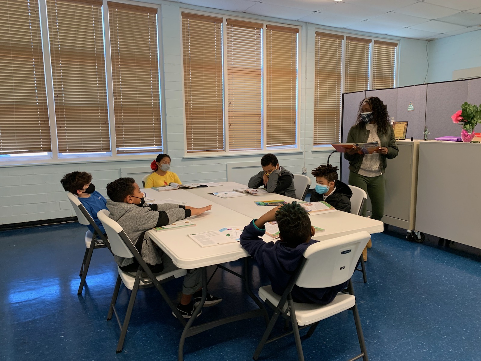 Catechist Ms. Shalonda Dailey teaches her class about the Bible and how to use it as a tool for research in their everyday lives