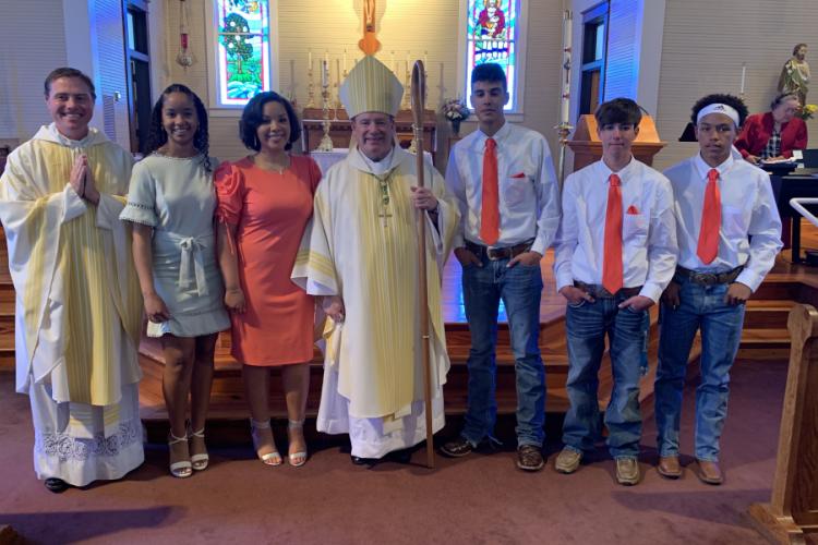 Confirmation was held at St. Augustine Church, Isle Brevelle, Louisiana on April 25. Pictured with the students is Father Charles Ray, pastor, and Bishop Robert W. Marshall.