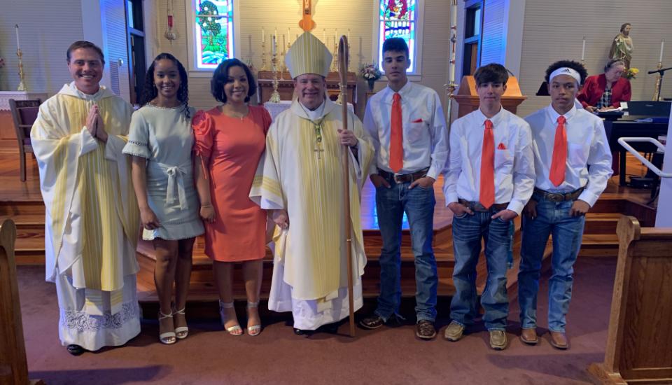Confirmation was held at St. Augustine Church, Isle Brevelle, Louisiana on April 25. Pictured with the students is Father Charles Ray, pastor, and Bishop Robert W. Marshall.