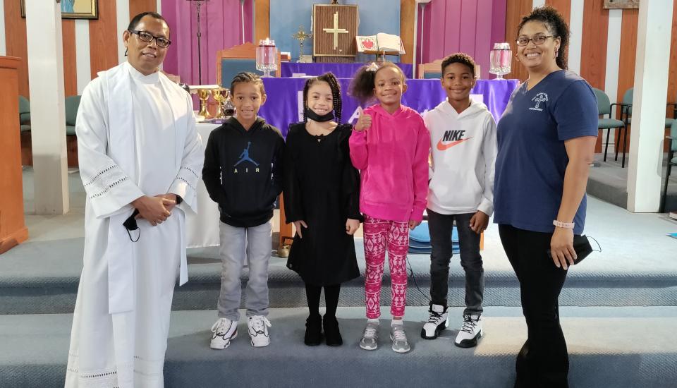 Fr. Jas and Catechist Chantel Normand Celebrate the Sacrament of First Reconciliation With the 2nd Grade Class